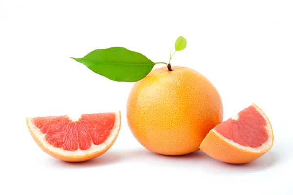 Ripe grapefruit with slices — Stock Photo, Image