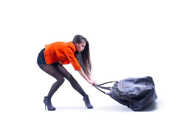 Woman carrying heavy bag — Stock Photo, Image