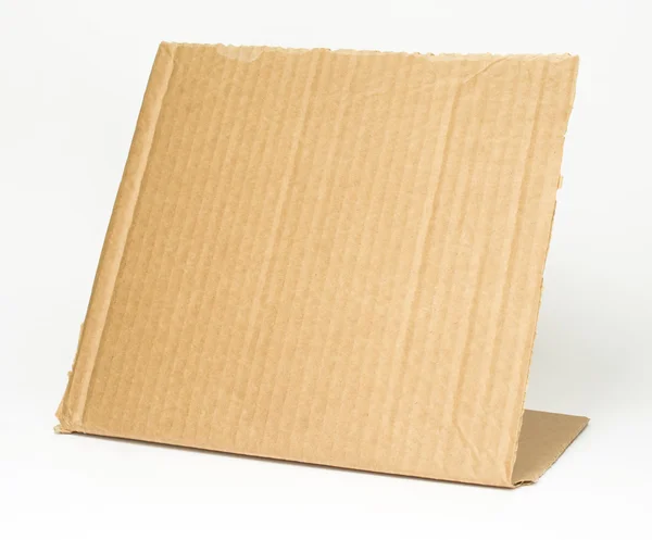 Pieza de cartón sobre fondo blanco — Foto de Stock