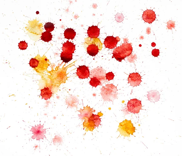 Red and yellow blots of watercolor paint