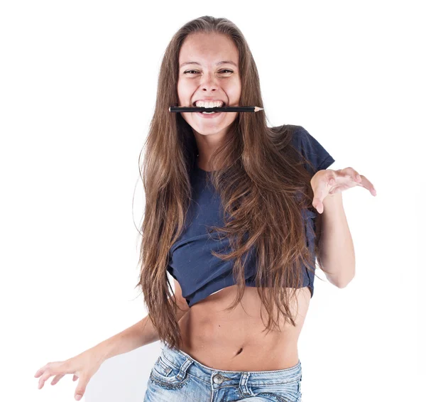 Mulher segurando lápis nos dentes — Fotografia de Stock