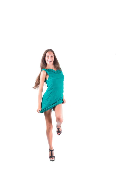 Красивая женщина танцует сексуальное зеленое платье — стоковое фото