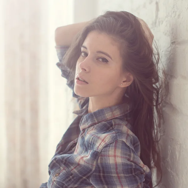 Young woman beautiful girl sunny day in a room filled with light — Stock Photo, Image