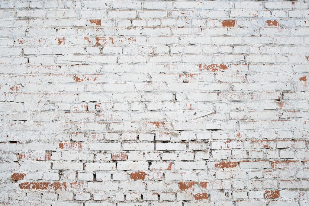 Cracked white grunge brick wall textured background stained old stucco aged paint grungy rusty blocks