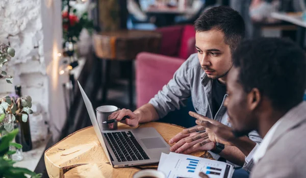 Two business partners working with laptop together. — Stock Photo, Image