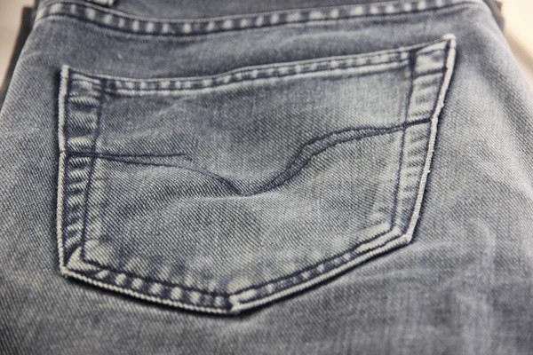 Een zwarte jeans van tectuur te zien achterzak. — Stockfoto