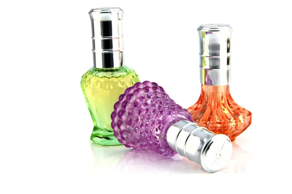 Tři barvy parfémy láhev. — Stock fotografie