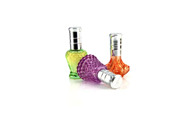 Drie kleuren parfumfles. — Stockfoto