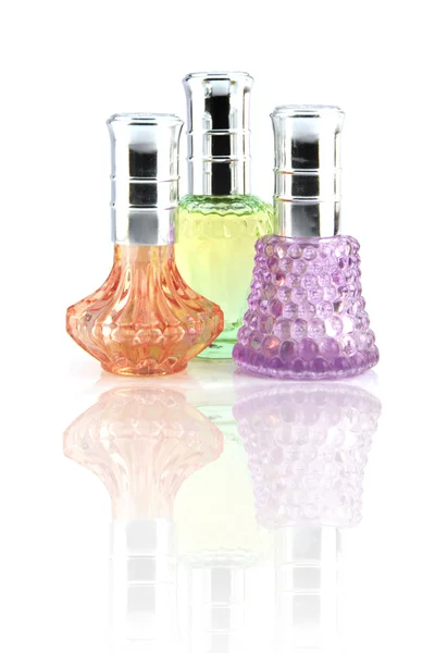 Drie kleuren parfumfles. — Stockfoto