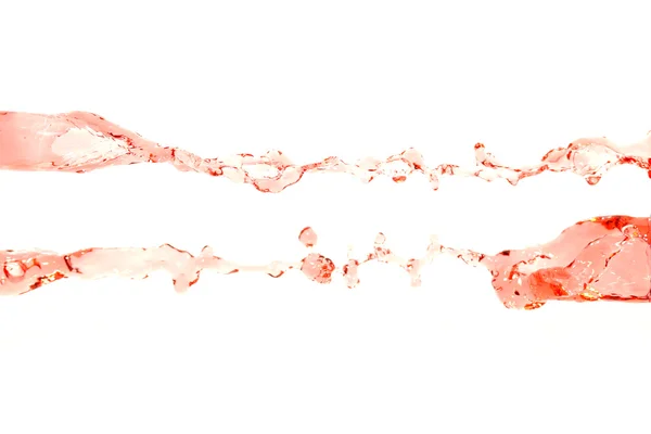 Água vermelha que se espalhou no fundo branco . — Fotografia de Stock