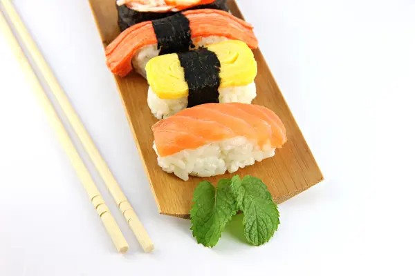 Sushi made form Tuna fish on a bamboo dish and Chopsticks — Stock Photo, Image