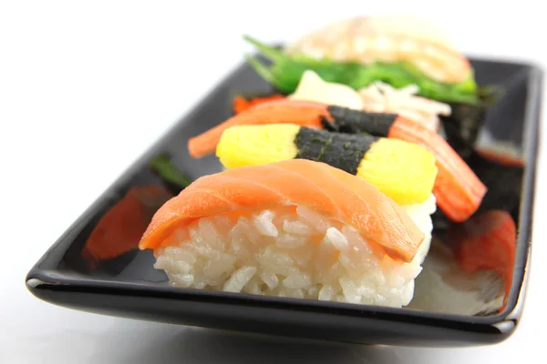 Tuna Sushi form seafood on Black dish. — Stock Photo, Image