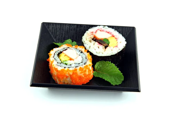Sushi feito de frutos do mar em um fundo branco . — Fotografia de Stock