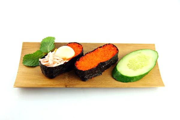 Sushi made form seafood on a bamboo dish. — Stock Photo, Image