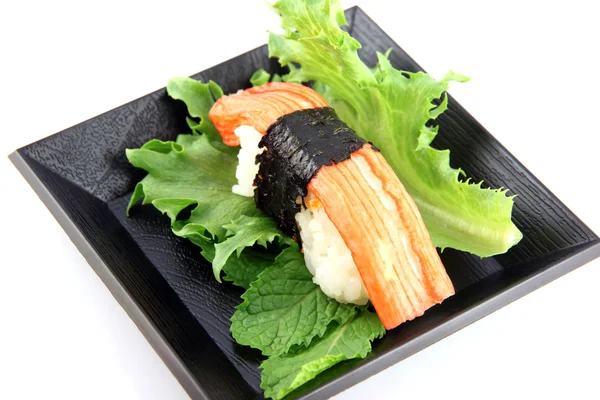 Crab meat Sushi in the black dish,Sushi is a food of Japanese. — Stock Photo, Image
