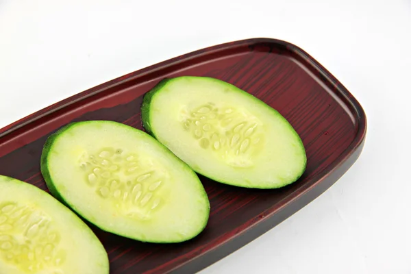 Cucumber slices placed in a dish. — Stock Photo, Image