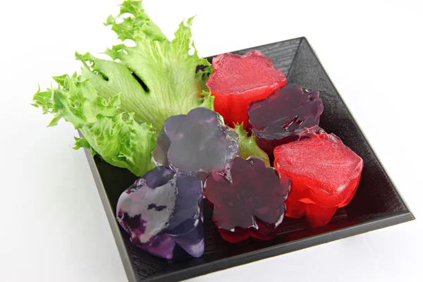 Red jelly and purple jelly in dish. — Stock Photo, Image