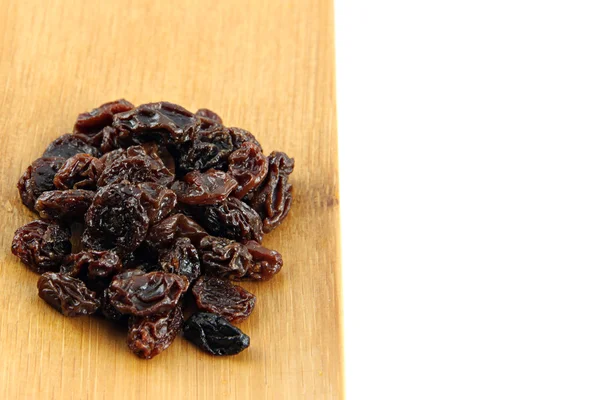 Raisin in the bamboo dish. — Stock Photo, Image