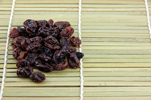 Raisin in the bamboo dish. — Stock Photo, Image