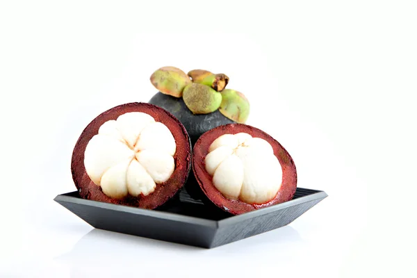 The Mangosteen on the Black dish. — Stock Photo, Image