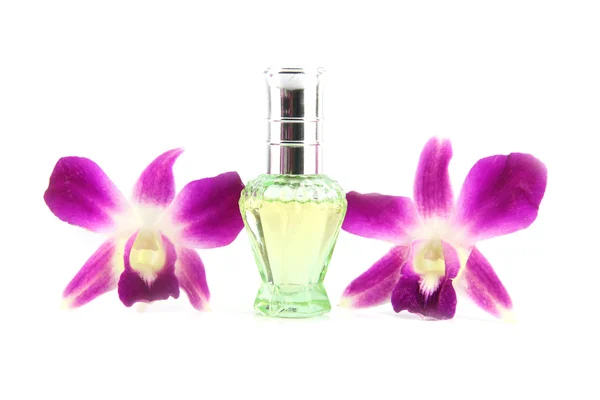 Frascos de orquídea roxa e perfume verde . — Fotografia de Stock