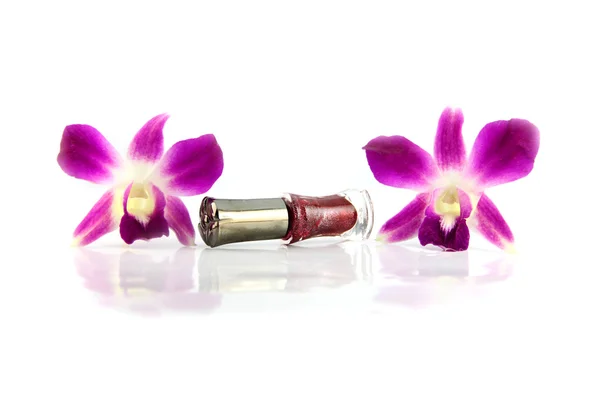 Purple orchid and brown Perfume bottles. — Stock Photo, Image