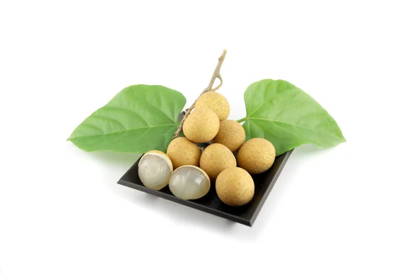 Longan of fruit on Black dish. — Stock Photo, Image