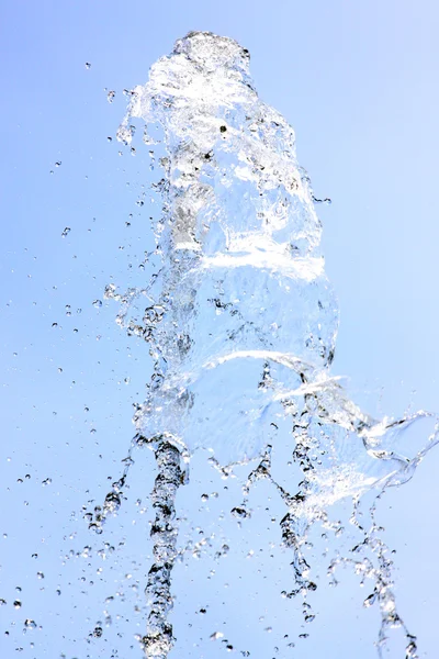 Water spread on a blue background. — Stock Photo, Image