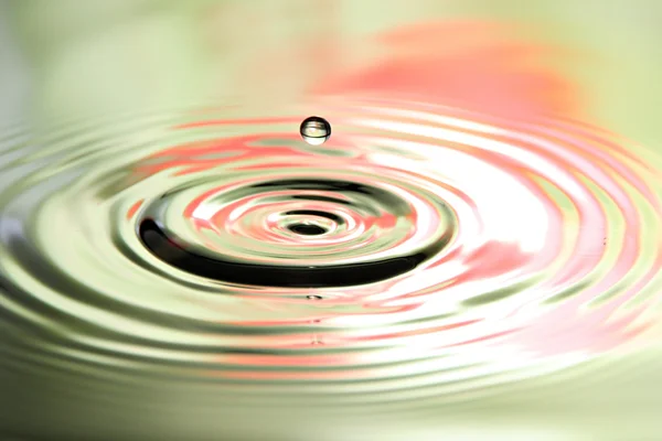 Pictures water drops a beautiful shape on Colorful Background. — Stock Photo, Image