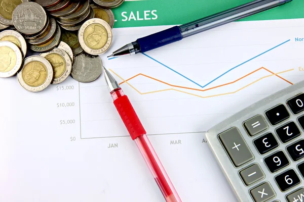 Pen and Calculator resting Near the money. — Stock Photo, Image