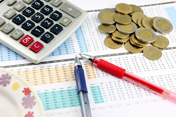 Money and office equipment that is placed on businesses graph. — Stock Photo, Image