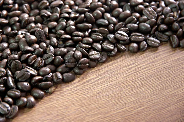 Coffee beans Rams on the old wooden background. — Stock Photo, Image