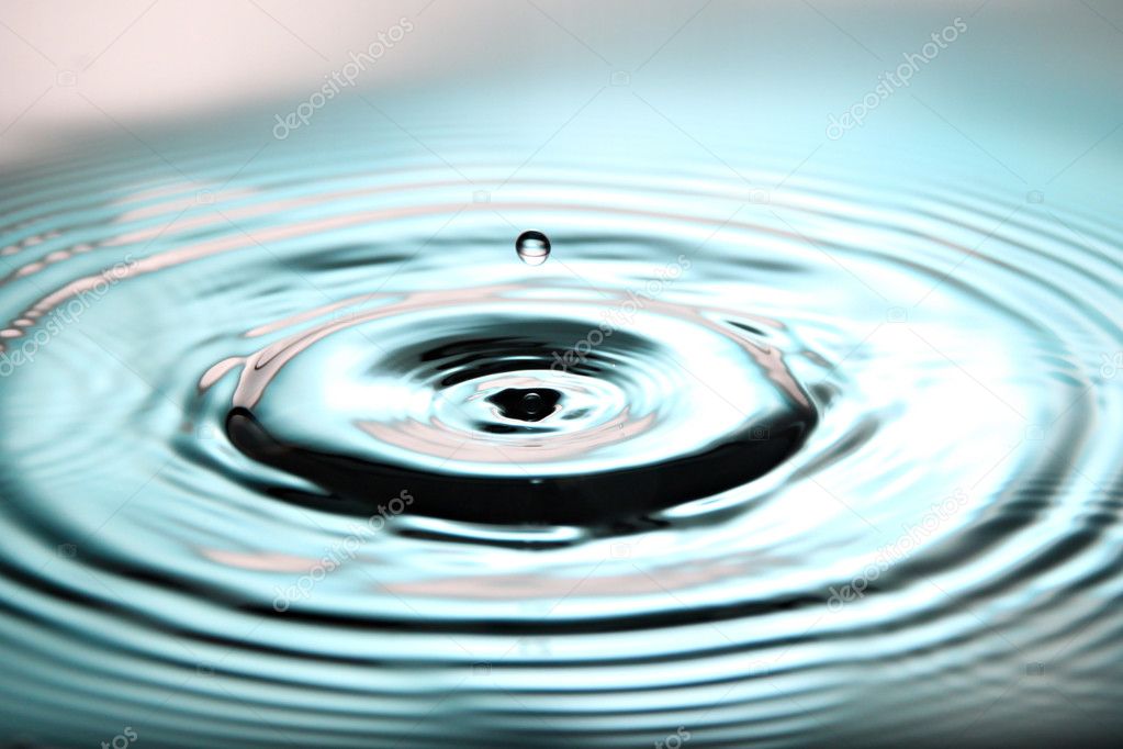 Blue Background of Ripple Water drops in Basin.