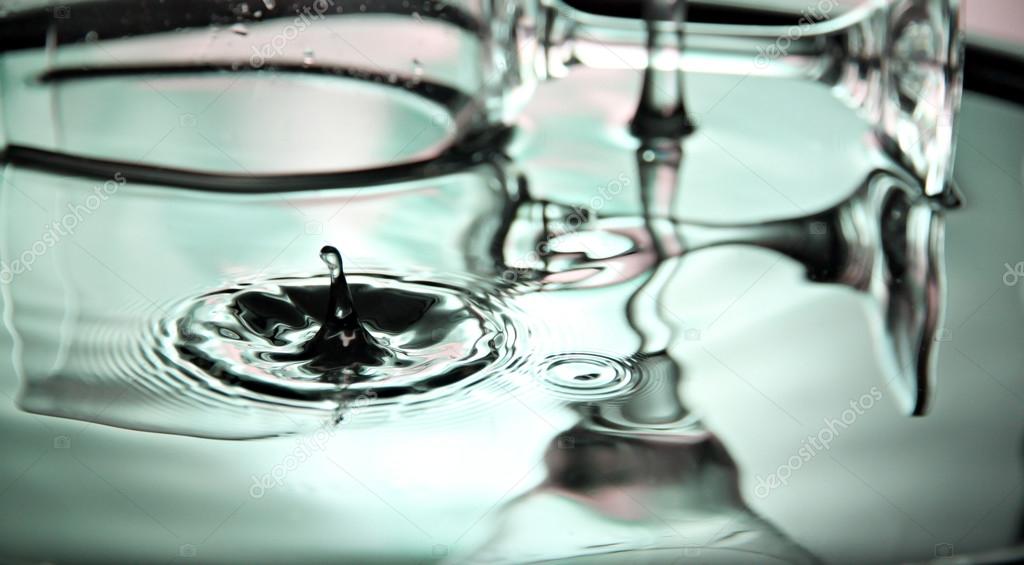 Green Water drops and Beverage glass in Basin.