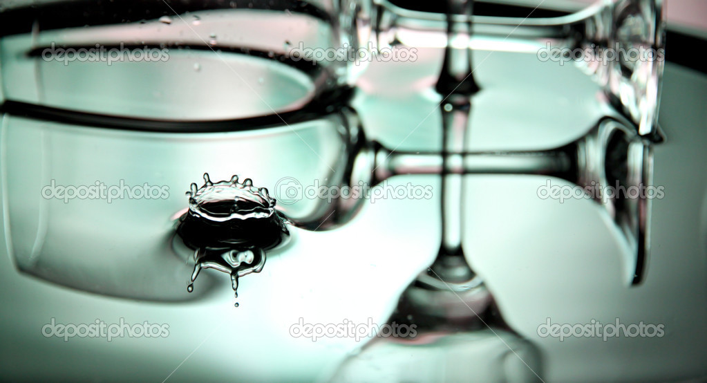 Green Water drops and Beverage glass in Basin.