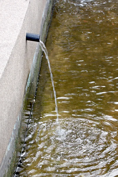 Water flowing out of pipe. — Stock Photo, Image