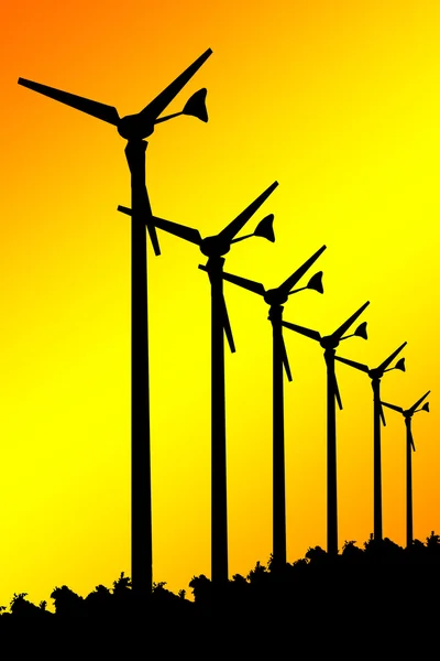 Turbinas eólicas silhuetas sobre fundo amarelo . — Fotografia de Stock