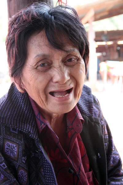 Portrait of a smiling elderly woman.