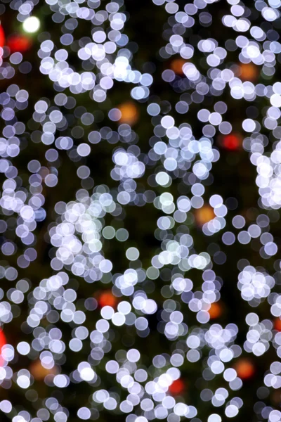 Bianco bokeh foto su sfondo nero . — Foto Stock