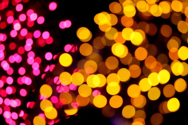 Immagine sfocata con rosa e giallo bokeh mix di notte . — Foto Stock