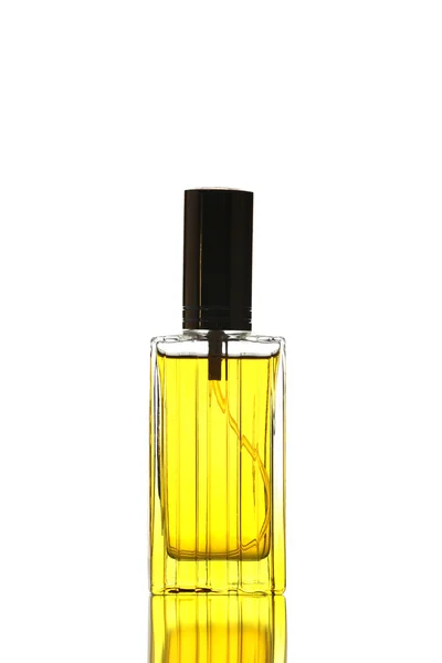 Bouteille de parfum jaune isolé . — Photo