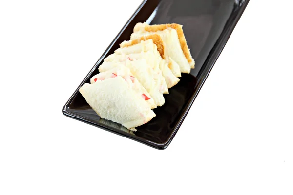 Bread sandwiches in black dish. — Stock Photo, Image