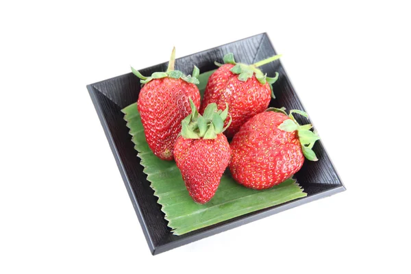 Strawberry in black bamboo dish. — Stock Photo, Image