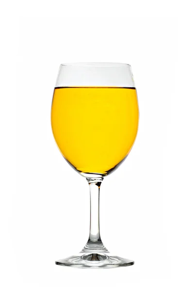 Żółte wody w wino kieliszek na białym tle. — Zdjęcie stockowe