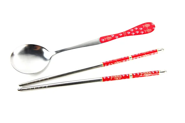 Stainless steel spoon and chopsticks with red pattern. — Stock Photo, Image