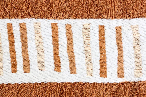 Vitt mönster på brun handdukar. — Stockfoto