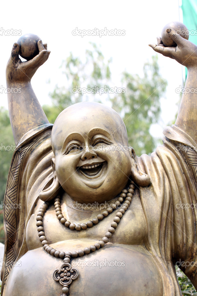 Statues of Chinese deity in smiling.