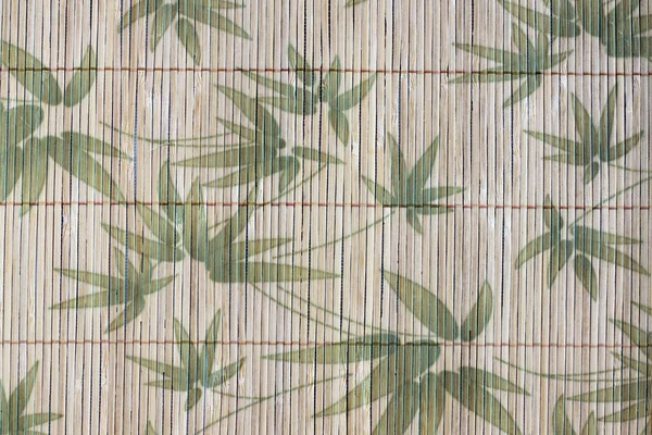 Kunst van het patroon bamboe bladeren op een houten achtergrond. — Stockfoto