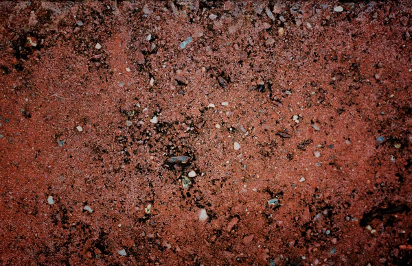 Wzór płyty z czerwonego kamienia na ciemny kolor. — Zdjęcie stockowe