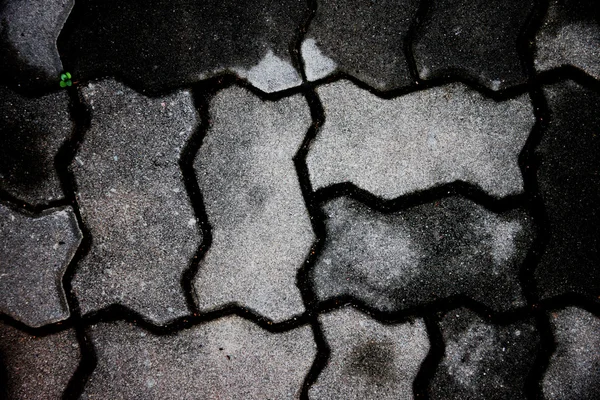 Donkere bakstenen voetpaden van achtergrond. — Stockfoto